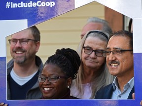 Amarjeet Sohi (R), Liberal candidate for Edmonton Mill Woods, poses with Co-Op housing officials after making a local housing announcement at the Briar Rose Estates Housing Co-Op in Edmonton, October 11, 2019. Ed Kaiser/Postmedia