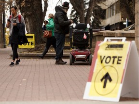 Voters are seen outside of a polling station at McKay Avenue School Archives and Museum at 10425 99 Avenue during the 2019 federal election in Edmonton on Oct. 21, 2019.