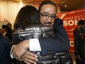 Edmonton Milll Woods Liberal candidate Amarjeet Sohi hugs a supporter after being defeated by Conservative candidate Tim Uppal in the federal election on Monday, Oct. 21, 2019.