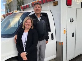 Dr. Roman Bayrock and wife Sandra with one of the four ambulances before it left Edmonton last month.