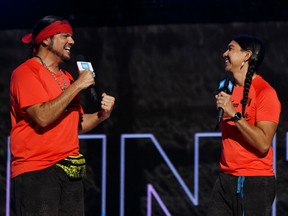 Amazing Race Canada Season 7 winners Anthony Johnson (left) and Dr. James Makoki speak during WE Day Alberta at Rogers Place in Edmonton, on Tuesday, Oct. 22, 2019. Photo by Ian Kucerak/Postmedia