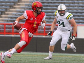Dino's Quarterback Josiah Joseph is seen running the ball during the first half of action as the U of C Dino's played host to the U of A Golden Bears at McMahon Stadium on Saturday, October 5, 2019.