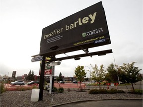 A University of Alberta billboard that suggests that climate change could result in a beefier barley yields, along 178 Street near 100 Avenue, in Edmonton Monday Sept. 30, 2019. University of Alberta vice-president Jacqui Tam has resigned her post over the billboard.