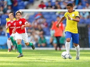A Brazilian player dribbles the ball against Hungary in the boys 2018 final ofat the Danone Nations Cup at the RCDE Stadium in Barcelona, Spain on Oct 12, 2019.