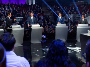 Bloc Quebecois leader Yves-Francois Blanchet, People's Party of Canada leader Maxime Bernier and Conservative leader Andrew Scheer listen to Liberal leader Justin Trudeau during the Federal leaders debate in Gatineau, Quebec, Canada October 7, 2019.