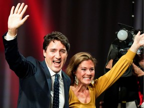 Liberal Leader and Prime Minister Justin Trudeau and his wife Sophie Gregoire Trudeau wave on stage after the federal election at the Palais des Congres in Montreal, Quebec, Canada Oct. 22, 2019.