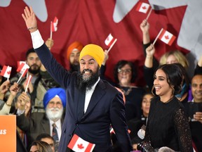 NDP leader Jagmeet Singh and his wife Gurkiran Kaur step on stage under the cheers of his supporters at the NDP Election Night Party in Burnaby B.C., on Oct. 21, 2019.