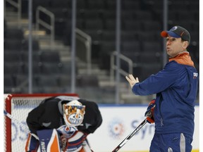 Jay Woodcroft (right) directs a drill during an Edmonton Oilers practice at Rogers Place in Edmonton, Alberta on Monday, November 14, 2016.