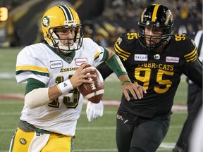 CP-Web. Edmonton Eskimos quarterback Logan Kilgore (15) scrambles under pressure from Hamilton Tiger Cats defensive end Julian Howsare (95) during first half CFL football game action in Hamilton, Ont., Friday, Oct. 4, 2019.