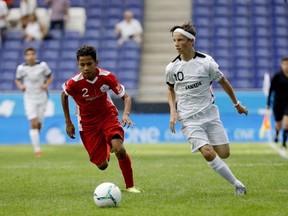 Canada's Isaac Charbonneau (No. 10), Vincenzo Reale (No. 9), Adrian Dagres (No. 6) and Adonis Botsinis (No. 12) look on as an Indonesian players scored on a penalty shot on goalkeeper Noah Campagnolo at the Danone Nations Cup at the RCDE Stadium in Barcelona, Spain on Oct 12, 2019.