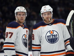 Connor McDavid and Leon Draisaitl of the Edmonton Oilers prepare to play the host New York Islanders on Oct. 8, 2019, in Uniondale, N.Y.