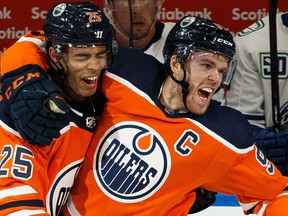 Darnell Nurse, left, and Connor McDavid celebrate McDavid's goal Oct. 2, 2019, in the Edmonton Oilers' win over the visiting Vancouver Canucks.