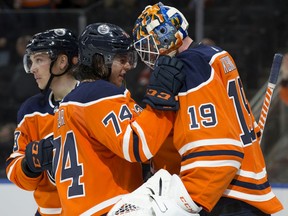 The Edmonton Oilers' Ethan Bear (74) congratulates goalie Mikko Koskinen (19) on the win following their game against the Philadelphia Flyers at Rogers Place, in Edmonton Wednesday Nov. 16, 2019. The Oilers won 6-3. Photo by David Bloom