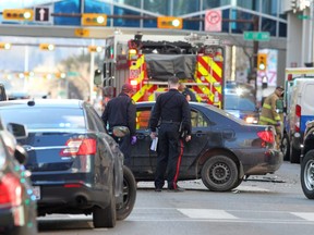 The scene downtown at 6th Ave. and 6th St. as police investigate an officer involved shooting in the core Saturday, October 19, 2019. Brendan Miller/Postmedia