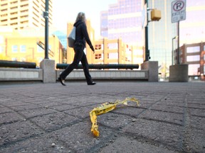 A single strand of police tape lays on the ground in front of the Edmonton Convention centre in downtown Edmonton on Tuesday, Oct. 1, 2019. Police are investigating a stabbing that occurred after a heavy metal concert on Monday.
