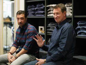 Hockey legend Wayne Gretzky (right) was at the new UNTUCKit clothing store at West Edmonton Mall on October 1, 2019 with business owner Chris Riccobono (left), where they met with a group of customers who won a contest that included a $500 gift card and a chance to meet Gretzky at the store. (PHOTO BY LARRY WONG/POSTMEDIA)