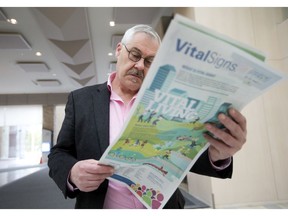 Barry Bailey reads the latest Vital Signs report, released by the Edmonton Community Foundation and Edmonton Social Planning Council at city hall in Edmonton on Wednesday, Oct. 2, 2019.