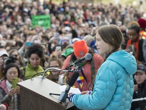 Swedish climate activist Greta Thunberg, in blue jacket, joined about 4,000 Edmonton youth, climate activists, and community members outside the Alberta Legislature in a climate strike. on October 18, 2019.