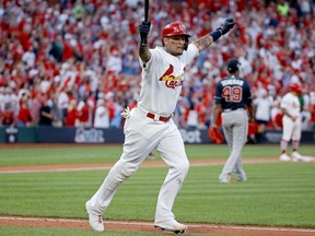 Yadier Molina of the Cardinals celebrates as he hits a walk-off sacrifice fly to give his team the 5-4 win over the Braves in Game 4 of the National League Division Series at Busch Stadium in St Louis on Monday, Oct. 7, 2019.