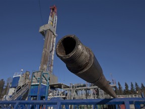 The threaded end of one of hundreds of drill pipes is shown in front of the Baytex Energy Ltd.'s Pembina oil rig near Pigeon Lake, Alberta, Canada on Friday, Feb. 17, 2012. Photographer: Norm Betts/Bloomberg