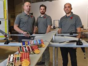 Veterans Cole Rosentreter (L), Joshua Richard and John Hryniw (R) have transitioned into civilian life by founding Pegasus Imagery, a company that uses drones to provide info to emergency services during disaster situations. Photo taken in Edmonton, Nov. 8, 2019. Ed Kaiser/Postmedia