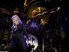 Stevie Nicks (left) and Mick Fleetwood of Fleetwood Mac perform at Rogers Place on Tuesday, Nov. 12.