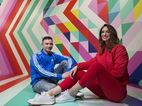Michelle Hoogveld and Rhys Douglas Farrell pose for a photo in their art installation titled "Oplandia" on display in Kingsway Mall, in Edmonton Tuesday Nov. 19, 2019. The installation is part of mall's CHROMAYEG art event.