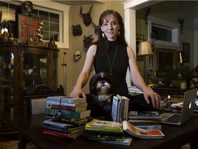 Bright Young Things artistic director Belinda Cornish and her dog Alice at work on the family dining table.