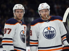 Connor McDavid and Leon Draisaitl of the Edmonton Oilers prepare to skate against the New York Islanders at NYCB's LIVE Nassau Coliseum on October 8, 2019 in Uniondale, N.Y.