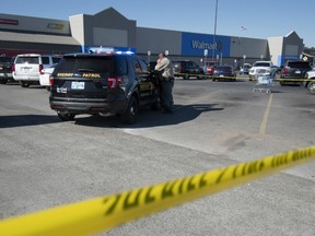 A police officer maintains a security line after a shooting in a Walmart parking lot on November 18, 2019 in Duncan, Oklahoma.