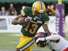 Edmonton Eskimos receiver Ricky Collins Jr. eludes a tackle from Montreal Alouettes linebacker Patrick Levels in Edmonton on Friday June 14, 2019.