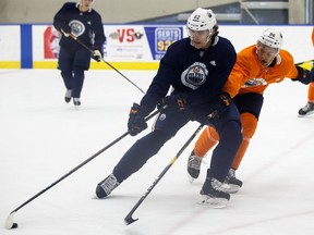 Raphael Lavoie (62) battles Philip Broberg (86) during Billy Moores Cup action at Edmonton Oilers 2019 Development Camp at the Rogers Place Downtown Community Arena in Edmonton, on Thursday, June 27, 2019. Photo by Ian Kucerak/Postmedia
