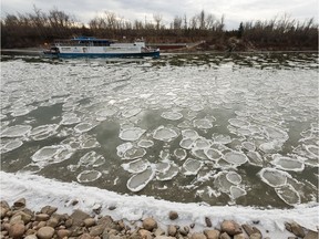 Ice forms on the North Saskatchewan River seen near the Edmonton Riverboat that's anchored across the river from Louise McKinney Riverfront Park in Edmonton, on Wednesday, Oct. 30, 2019.