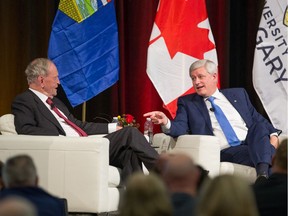 Canada's 20th prime minister Jean Chrétien and 22nd prime minister Stephen Harper speak Thursday in Calgary.