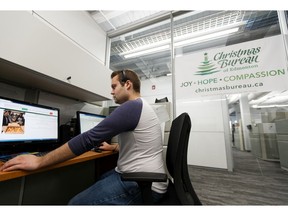 Eric Schiller, client intake team member with the Christmas Bureau of Edmonton, works in the organization's call centre at the Jerry Forbes Centre for Community Spirit in Edmonton, on Friday, Nov. 1, 2019. Photo by Ian Kucerak/Postmedia