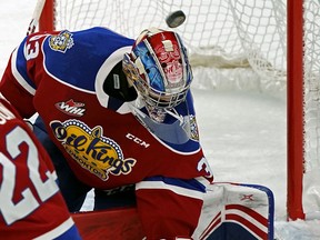 Edmonton Oil Kings goalie Sebastian Cossa looks for the puck during WHL hockey game action against the Saskatoon Blades in Edmonton on Friday Nov. 1, 2019.