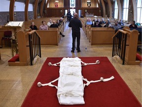 Shroud wrappings lay on the floor as a seminar investigation gets underway into the trend of green burial practices in Edmonton, November 3, 2019. With a green burial, families may assume many of the responsibilities which in recent times were relegated to funeral homes. Ed Kaiser/Postmedia