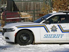 A sheriff watches a property in Wetaskiwin County on November 6, 2019, when the Alberta government announced their initial plan to combat rural crime in Alberta.