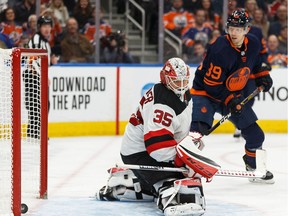 Edmonton Oilers' Alex Chiasson (39) scores a goal on New Jersey Devils' goaltender Cory Schneider (35) during the third period of a NHL hockey game at Rogers Place in Edmonton, on Friday, Nov. 8, 2019.