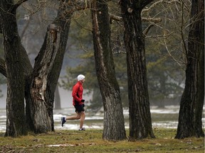 A man goes for a run in his shorts at Hawrelak Park in Edmonton on Friday November 8, 2019.