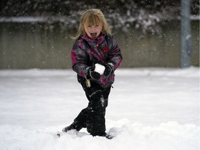 Rebecca Hall (5-years-old) plays in the snow at Gold Bar Park on Saturday November 9, 2019 as up to 20 centimeters of snowfall fell in the Edmonton region.