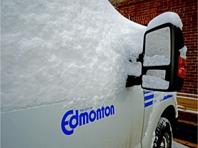 A City of Edmonton truck is covered in snow on November 10, 2019. A seasonal parking ban will take effect in the city of Edmonton on Sunday November 10 at 11pm.