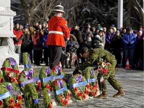 A soldier lays a wreath during the Loyal Edmonton Regiment's (4 PPCLI) Remembrance Day ceremony at Edmonton City Hall on Monday November 11, 2019.