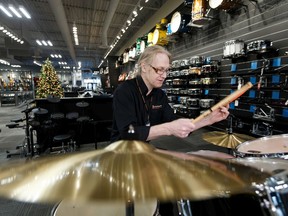 Tom Waterson plays drums in the new Long & McQuade Musical Instruments store at 6633 118 Avenue in Edmonton's Highlands neighbourhood, on Friday, Nov. 22, 2019. Photo by Ian Kucerak/Postmedia