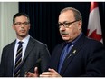 Alberta Justice Minister Doug Schweitzer, left, with Alberta Transportation Minister Ric McIver, said on Tuesday, Nov. 26, 2019, changes to election financing law are coming next year.
