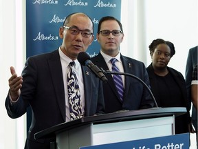 Alberta associate minister of mental health and addictions Jason Luan, left, and Alberta Advanced Education Minister Demetrios Nicolaides announce the expansion of mental health and addiction supports for post-secondary students, at the Northern Alberta Institute of Technology in Edmonton on Wednesday, Nov. 27, 2019.
