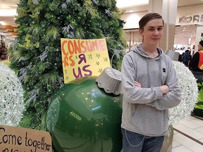 Abram Ilcisin, an organizer with Edmonton Youth for Climate, participated in an anti-consumerism, pro-climate protest in Southgate Centre mall in Edmonton on Friday Nov. 29, 2019.