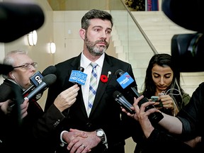 Edmonton Mayor Don Iveson comments, at city hall on Tuesday, Nov. 5, 2019, on the effects of the budget restraints imposed by the provincial government.