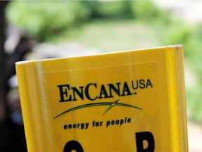 A yellow Encana natural gas pipeline marker is seen in this file photo taken in Kalkaska, Michigan. The company said on Oct. 31, 2019 that it will move its headquarters fo the U.S. from Canada.