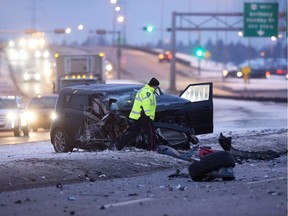 Police investigate at the scene of a two vehicle collision along north bound 91 Street south of the Anthony Henday, in Edmonton. File photo.